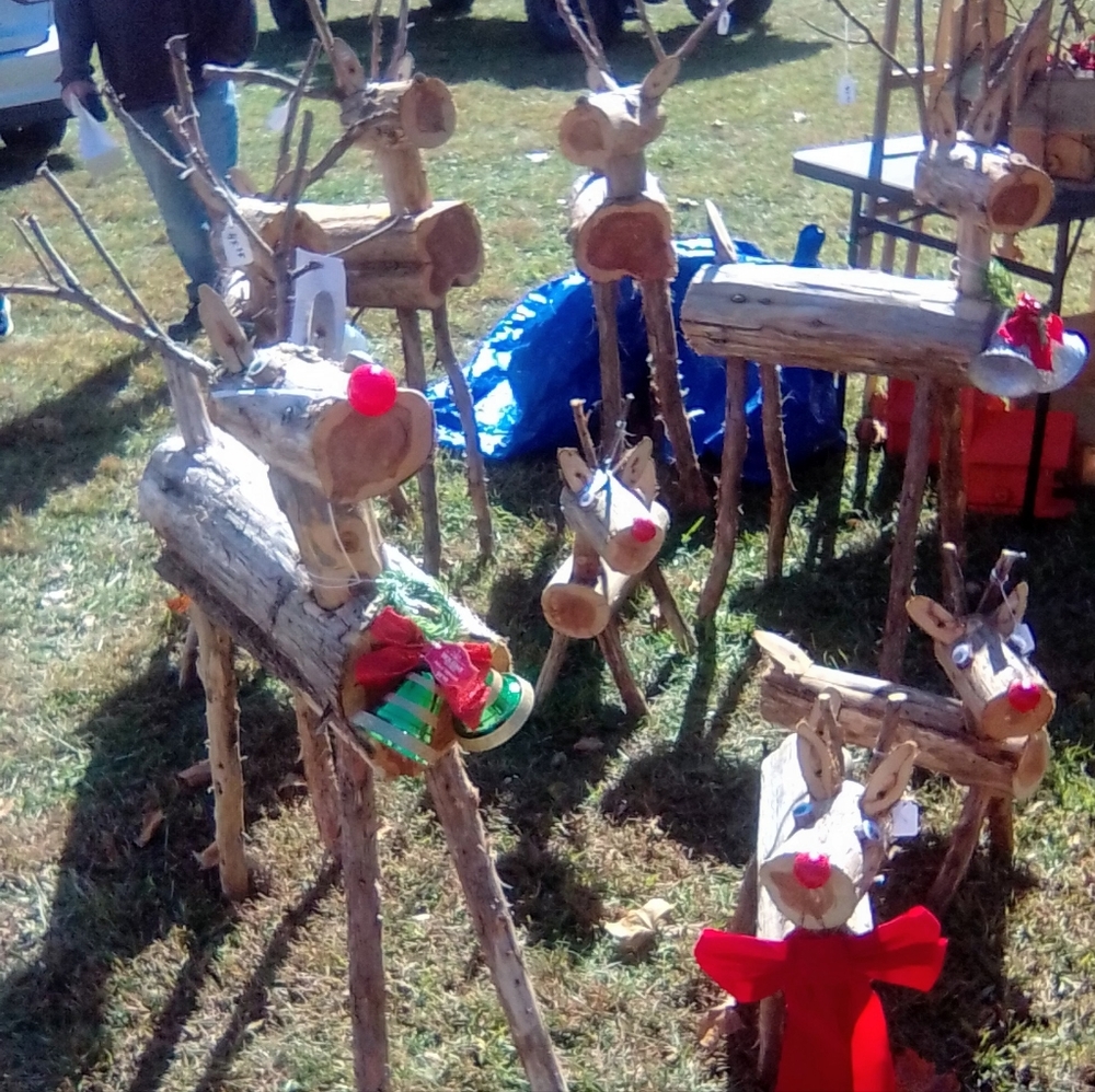 Handmade Santa's reindeers out of live cut logs